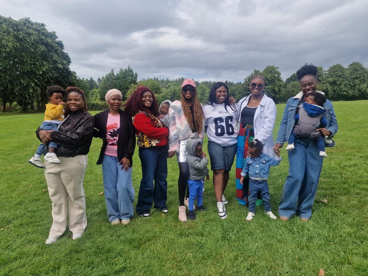 Small group of mothers with babies at the summer party